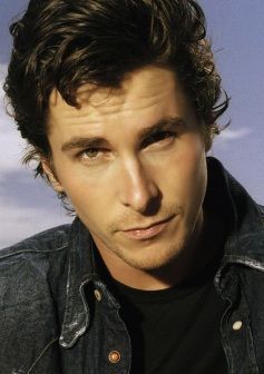 christian-bale-with-a-curly-thick-medium-hairstyle-on-beach-jean-jacket_zps04aa35b1.jpg