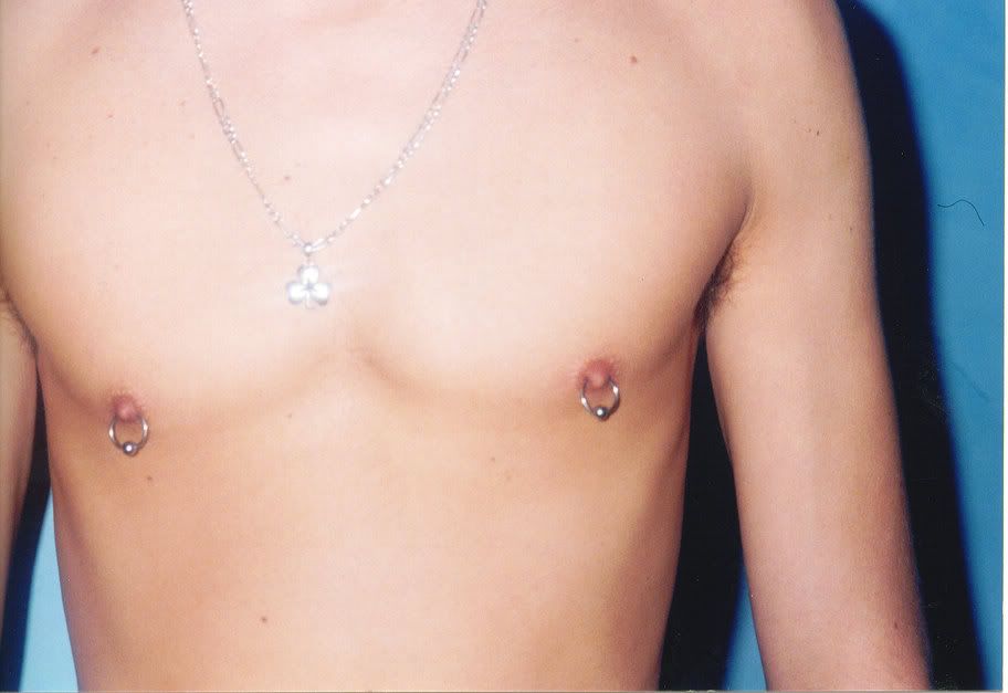 pierced nipple photos. Male Nipple Piercing Image