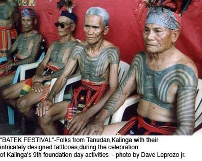 a previous tattoo and added some Filipino tribals around it.