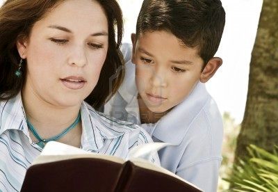 photo 7206700-mother-and-son-reading-a-bible-2.jpg