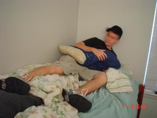 JT being his usual disrespectful self... shoes on bed! photo college9.jpg