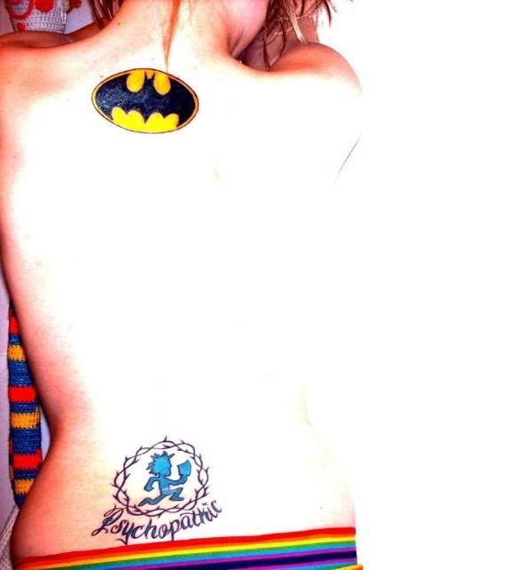Sexy woman upper back batman tattoo